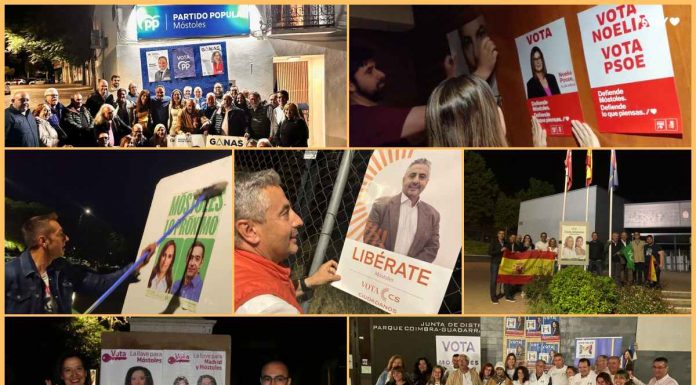 Pegada de carteles en Móstoles para iniciar la campaña electoral del 28 M
